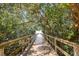 Tranquil boardwalk path shaded by lush trees and foliage at 2715 Terra Ceia Bay Blvd # 201, Palmetto, FL 34221