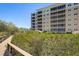 Boardwalk path winds through lush landscaping toward condo building at 2715 Terra Ceia Bay Blvd # 201, Palmetto, FL 34221