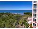 Exterior view showing waterfront scenery with lush foliage and partial condo building at 2715 Terra Ceia Bay Blvd # 201, Palmetto, FL 34221
