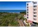 Exterior view showing waterfront scenery with lush foliage and partial condo building at 2715 Terra Ceia Bay Blvd # 201, Palmetto, FL 34221