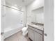 Clean bathroom featuring a shower-tub combo, granite countertop and tile flooring at 3718 Mossy Limb Ct, Palmetto, FL 34221