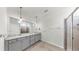This bathroom features double sinks, granite countertops, and a glass-enclosed shower at 3718 Mossy Limb Ct, Palmetto, FL 34221