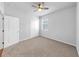 Neutral bedroom featuring plush carpet, ceiling fan, and a bright window at 3718 Mossy Limb Ct, Palmetto, FL 34221