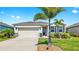 Charming single-story home featuring a two-car garage, complemented by a beautifully landscaped front yard at 3718 Mossy Limb Ct, Palmetto, FL 34221