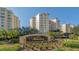 Exterior view of Meridian community with palm trees and signage at 393 N Point Rd # 603, Osprey, FL 34229