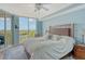 Bright bedroom with water views and king-size bed at 393 N Point Rd # 603, Osprey, FL 34229