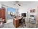 Bright home office features a large window, built-in desk, and city views at 401 Quay Commons # 803, Sarasota, FL 34236