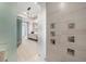 Modern shower with glass enclosure and rainfall shower head at 401 Quay Commons # 803, Sarasota, FL 34236