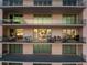 Large balcony with multiple seating areas and water views at 401 Quay Commons # 803, Sarasota, FL 34236