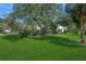 Landscaped yard showcasing a home's curb appeal at 4301 Brackenwood Ct, Sarasota, FL 34232