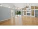 Living room with hardwood floors, vaulted ceiling and pool access at 4301 Brackenwood Ct, Sarasota, FL 34232