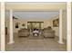 Spacious living room with tiled floors and access to the pool area at 524 Oak Bay Dr, Osprey, FL 34229