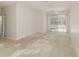 Empty living room with sliding doors leading to backyard at 6427 Golden Leaf Ct, Lakewood Ranch, FL 34202