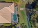 Aerial view showcasing the home's pool and canal view at 650 Crane Prairie Way, Osprey, FL 34229