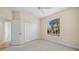Bright bedroom with neutral walls, carpet, and a ceiling fan at 650 Crane Prairie Way, Osprey, FL 34229