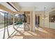 Dining room with access to a beautiful pool and screened lanai at 650 Crane Prairie Way, Osprey, FL 34229