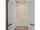 Hallway with archway and decorative niche, offering a glimpse into other rooms at 650 Crane Prairie Way, Osprey, FL 34229