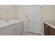 Laundry room with washer, dryer, and storage at 650 Crane Prairie Way, Osprey, FL 34229