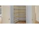 Walk-in pantry features built-in shelving and tile flooring, offering ample storage space at 650 Crane Prairie Way, Osprey, FL 34229