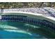 Close-up of a spa-like pool with blue tile and waterfall feature at 650 Crane Prairie Way, Osprey, FL 34229