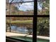 View from the screened-in patio with a view of the beautiful water feature at 650 Crane Prairie Way, Osprey, FL 34229