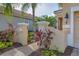 Landscaped entryway with brick pavers and elegant pillars at 7116 Presidio Gln, Lakewood Ranch, FL 34202