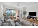 Living room with sliding doors leading to the pool and patio area at 7116 Presidio Gln, Lakewood Ranch, FL 34202