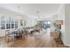 Spacious living area with hardwood floors, modern furniture, and sliding glass doors to lanai at 7116 Presidio Gln, Lakewood Ranch, FL 34202