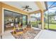 This screened lanai provides seamless indoor/outdoor living and views of the home's backyard at 7116 Presidio Gln, Lakewood Ranch, FL 34202