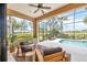 Relaxing screened lanai with comfortable seating overlooking the pool and well-manicured grounds at 7116 Presidio Gln, Lakewood Ranch, FL 34202