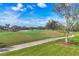 Landscaped golf course with a walking path at 7116 Presidio Gln, Lakewood Ranch, FL 34202