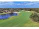 Aerial view of a golf course with water features and residential homes at 7116 Presidio Gln, Lakewood Ranch, FL 34202