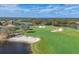 Golf course with sand traps and water features near residential homes at 7116 Presidio Gln, Lakewood Ranch, FL 34202