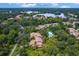 Aerial view of community with lake, lush landscaping, and homes at 7547 Silver Fern Blvd # 54, Sarasota, FL 34241