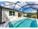 Relaxing screened pool with a spa, and views of the backyard at 9281 Ballaster Pointe Loop, Parrish, FL 34219