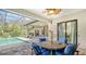 Covered patio with pool views and comfortable seating at 9291 Swaying Branch Rd, Sarasota, FL 34241