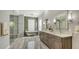 Spa-like bathroom with a soaking tub, walk-in shower, and double vanity at 9291 Swaying Branch Rd, Sarasota, FL 34241