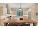 Large kitchen island with wood countertop and stainless steel appliances at 9291 Swaying Branch Rd, Sarasota, FL 34241