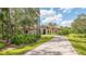 Exterior of a beautiful home with tile roof and landscaping at 9291 Swaying Branch Rd, Sarasota, FL 34241