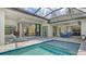 Resort-style backyard oasis with a beautiful pool and spacious patio at 9291 Swaying Branch Rd, Sarasota, FL 34241