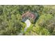 Aerial view of house, showcasing the tile roof and pool at 9291 Swaying Branch Rd, Sarasota, FL 34241