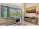 Spacious living room with comfortable seating, large TV, and pool views at 9291 Swaying Branch Rd, Sarasota, FL 34241