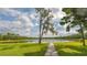 Scenic walkway alongside peaceful lake at 9291 Swaying Branch Rd, Sarasota, FL 34241