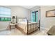 Relaxing bedroom featuring neutral decor and an abundance of natural light at 9291 Swaying Branch Rd, Sarasota, FL 34241