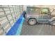 Garage with upgraded floor covering and ample space for parking at 9291 Swaying Branch Rd, Sarasota, FL 34241