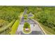 Gated community entrance with paved road and landscaping at 9291 Swaying Branch Rd, Sarasota, FL 34241