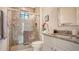 Modern bathroom with a walk-in shower, toilet and granite countertop at 9291 Swaying Branch Rd, Sarasota, FL 34241