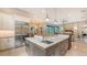 Island kitchen with double sink, stainless steel appliances, and marble countertop at 9291 Swaying Branch Rd, Sarasota, FL 34241