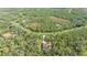 Aerial view showcasing home's location in a quiet, wooded community at 9291 Swaying Branch Rd, Sarasota, FL 34241