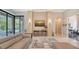 Open floor plan living room with pool view and sectional sofa at 9291 Swaying Branch Rd, Sarasota, FL 34241